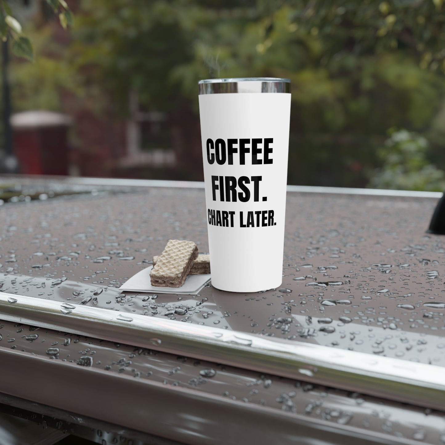 “Coffee First, Chart Later” tumbler staged on hood of car with wafers