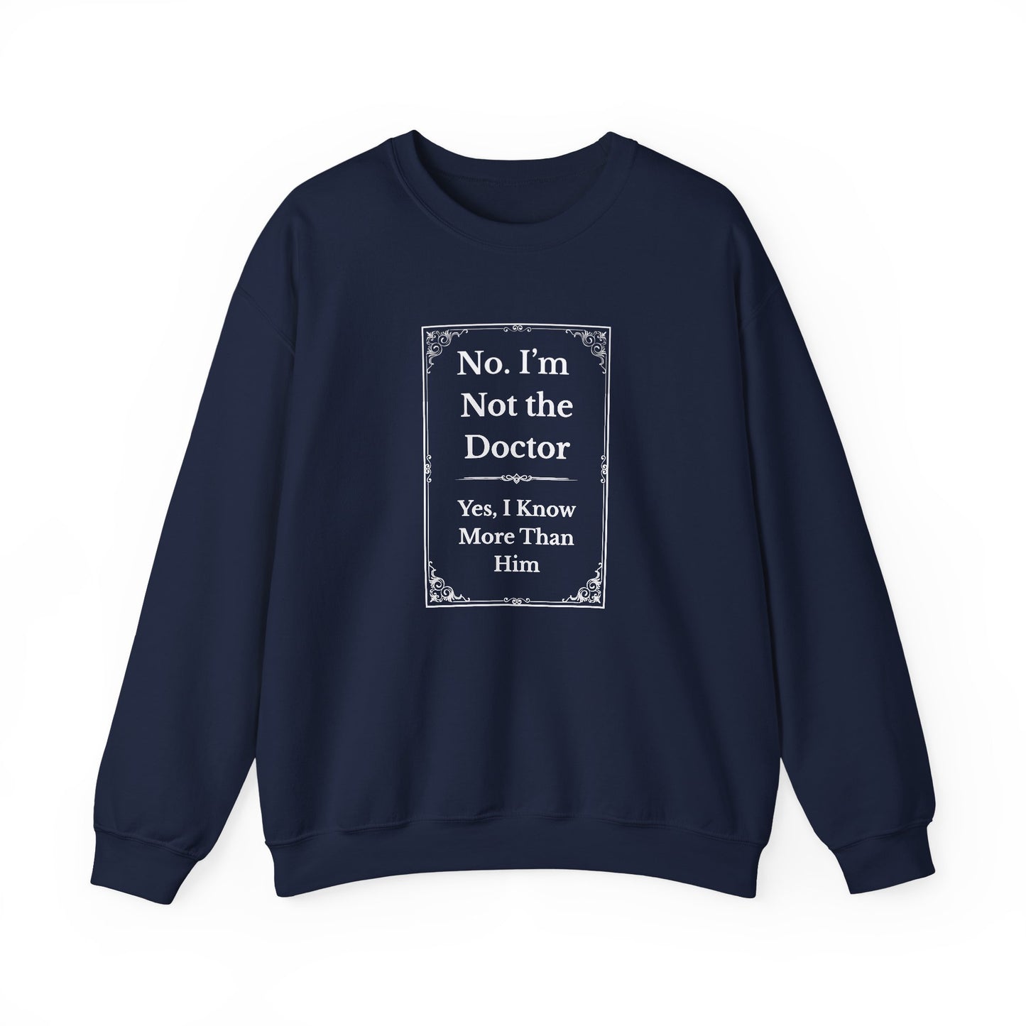 Flat lay of navy crewneck with white text reading “No, I’m Not the Doctor. We Have More Fun” on center chest