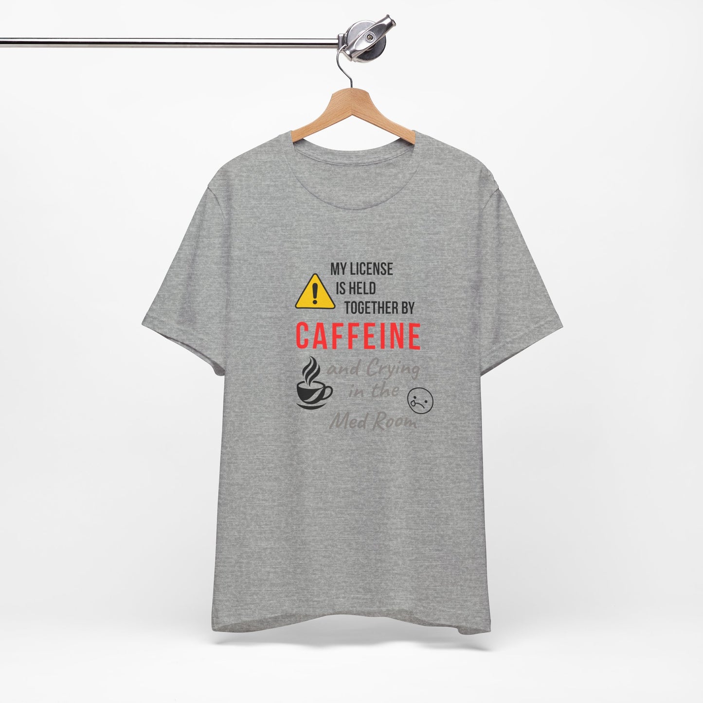 Clean gray shirt with “Held Together by Caffeine” design, perfect minimalist display.
