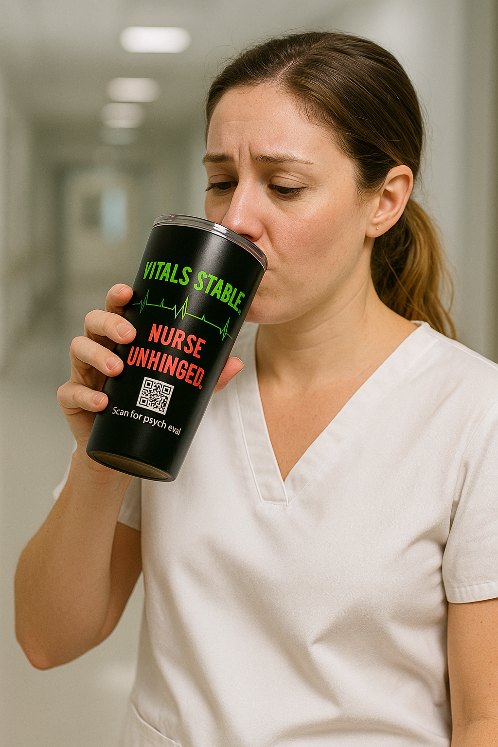 Nurse in white scrubs sipping coffee from stainless steel “Nurse Unhinged” tumbler.