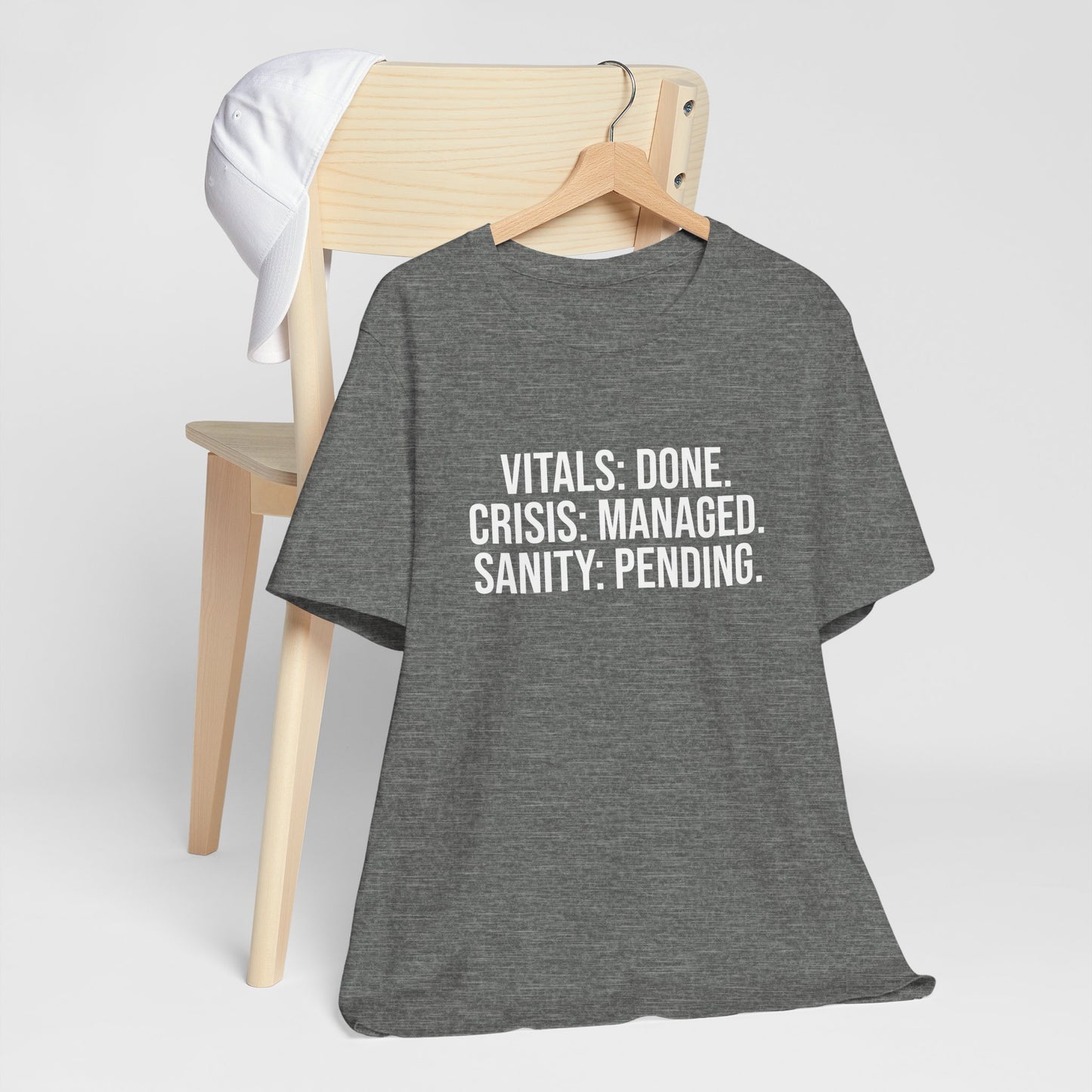 Gray tee flat lay with nurse burnout message visible.