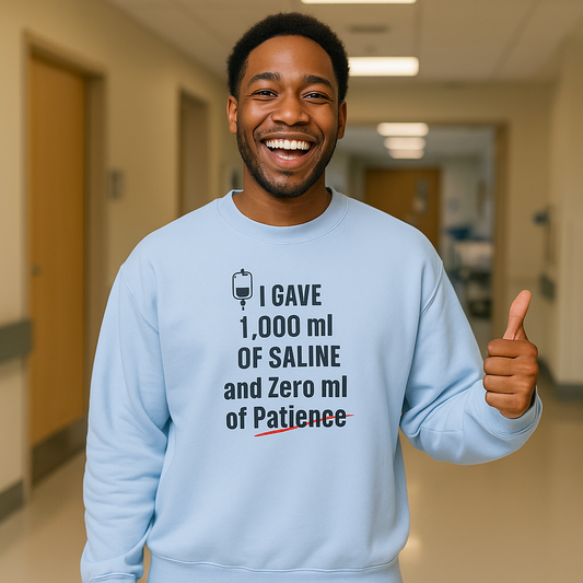 Funny nurse sweatshirt with quote “1000mL of Saline, 0mL of Patience,” worn by burned-out RN mid-shift trying not to scream
