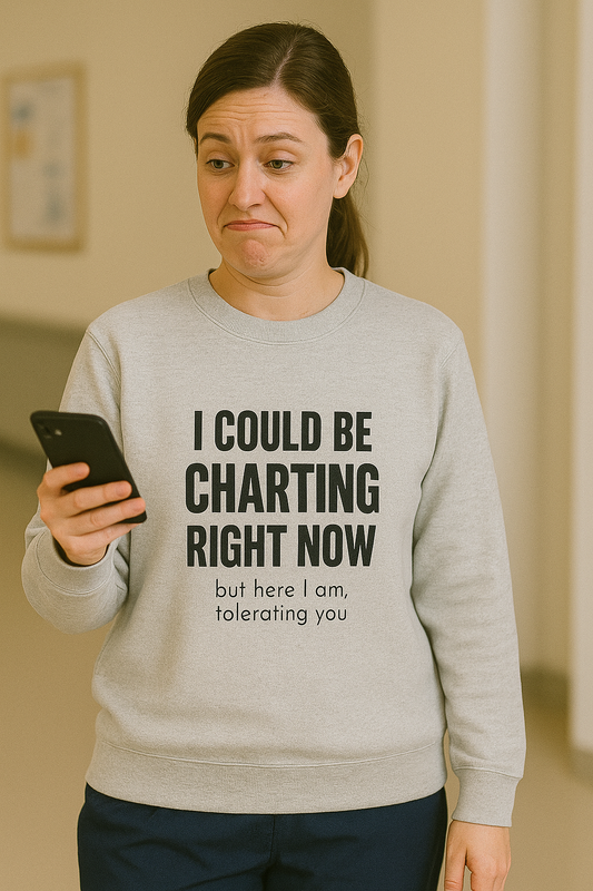 Funny nurse sweatshirt with quote “I Could Be Charting,” worn by annoyed RN sipping coffee while actively ignoring responsibility

