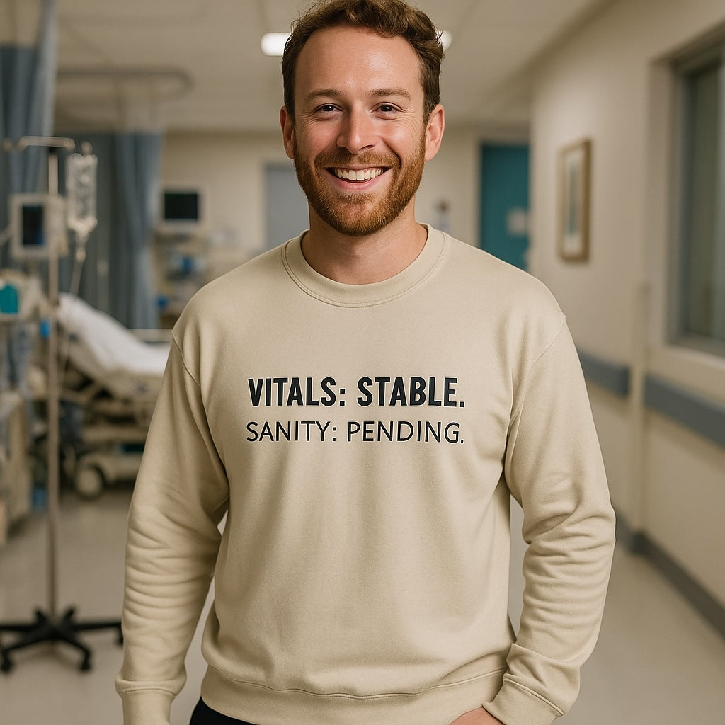 male nurse wearing Vitals Stable sweatshirt while waiting for a patient in the ER