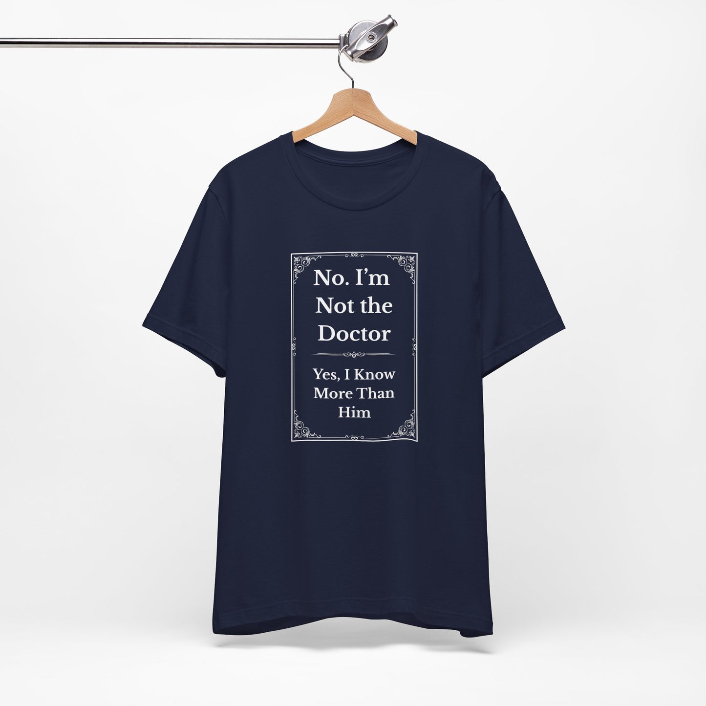 Navy t-shirt with white text design "Not the Doctor, Just Smarter" on hanger for product display.
