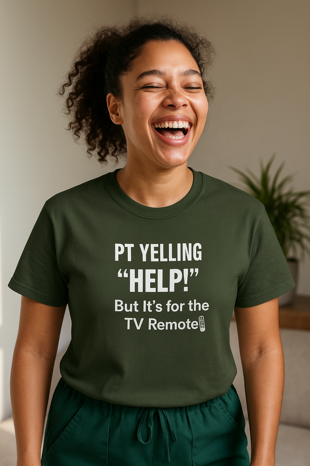 Smiling nurse with bun wearing olive “PT Yelling Help” shirt and blue scrubs.
