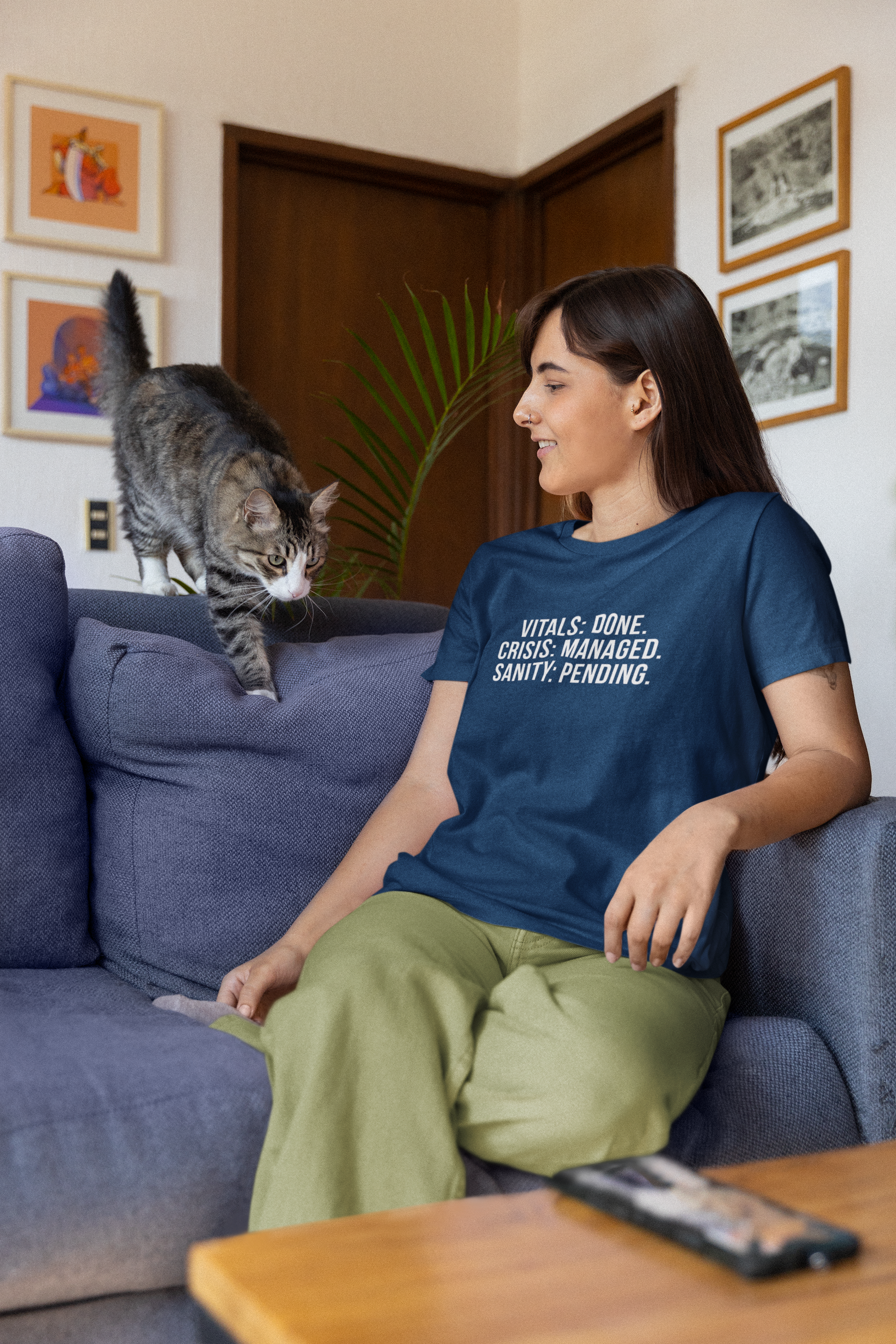 model on the couch with a cat
